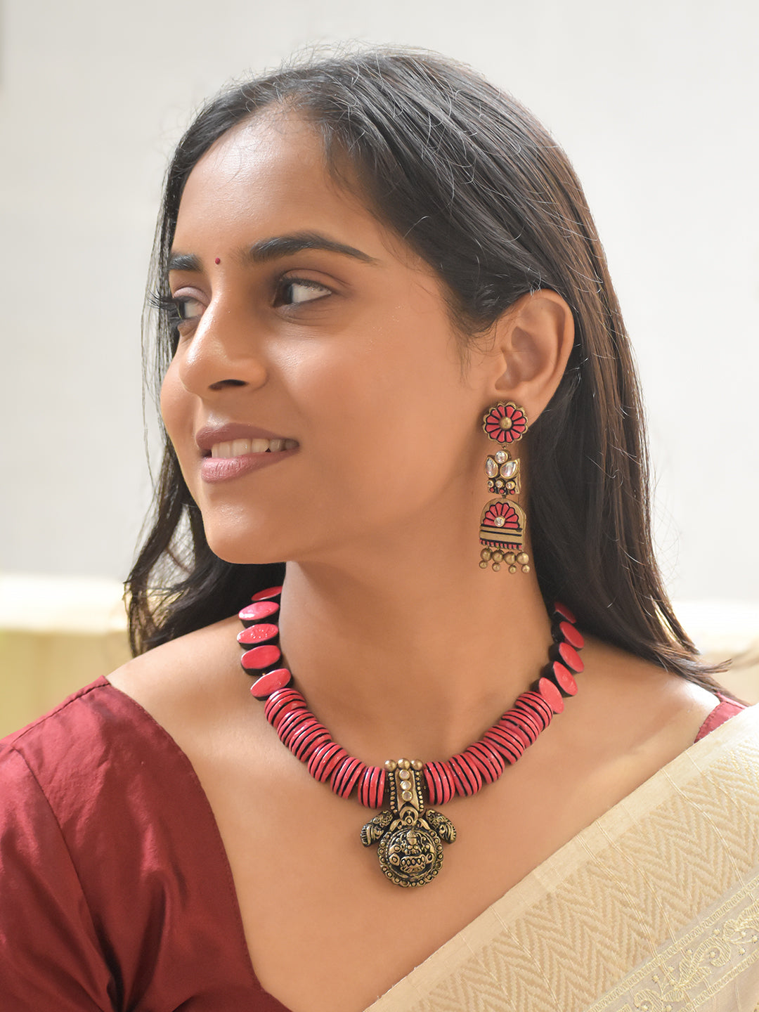 Handcrafted Terracotta Lakshmi Pendant Necklace Set with Pink Beads and Statement Earrings