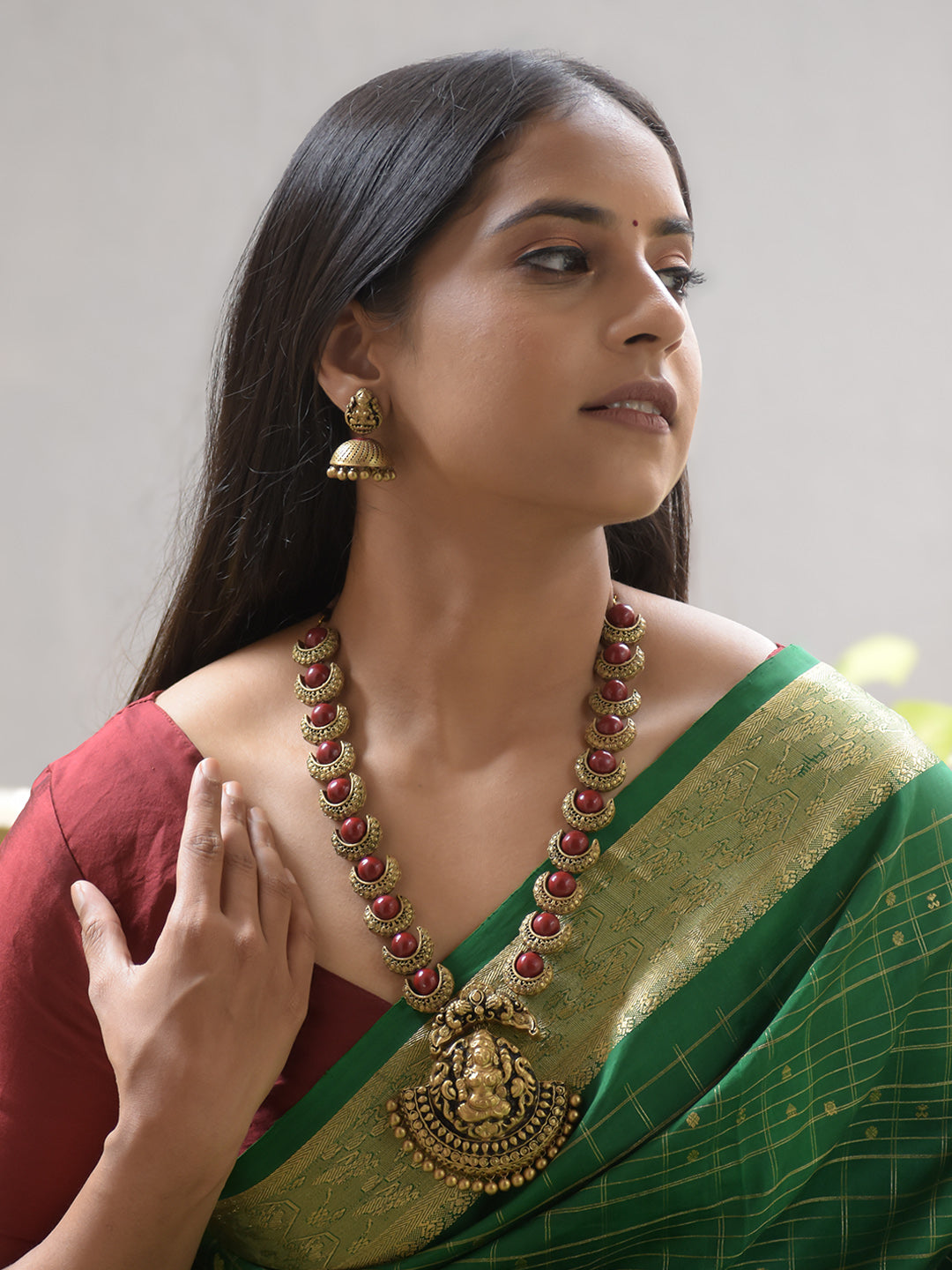 Chandrika - Handcrafted Terracotta Lakshmi Pendant Necklace Set with Red Crescent Beads and Antique Finish Earrings