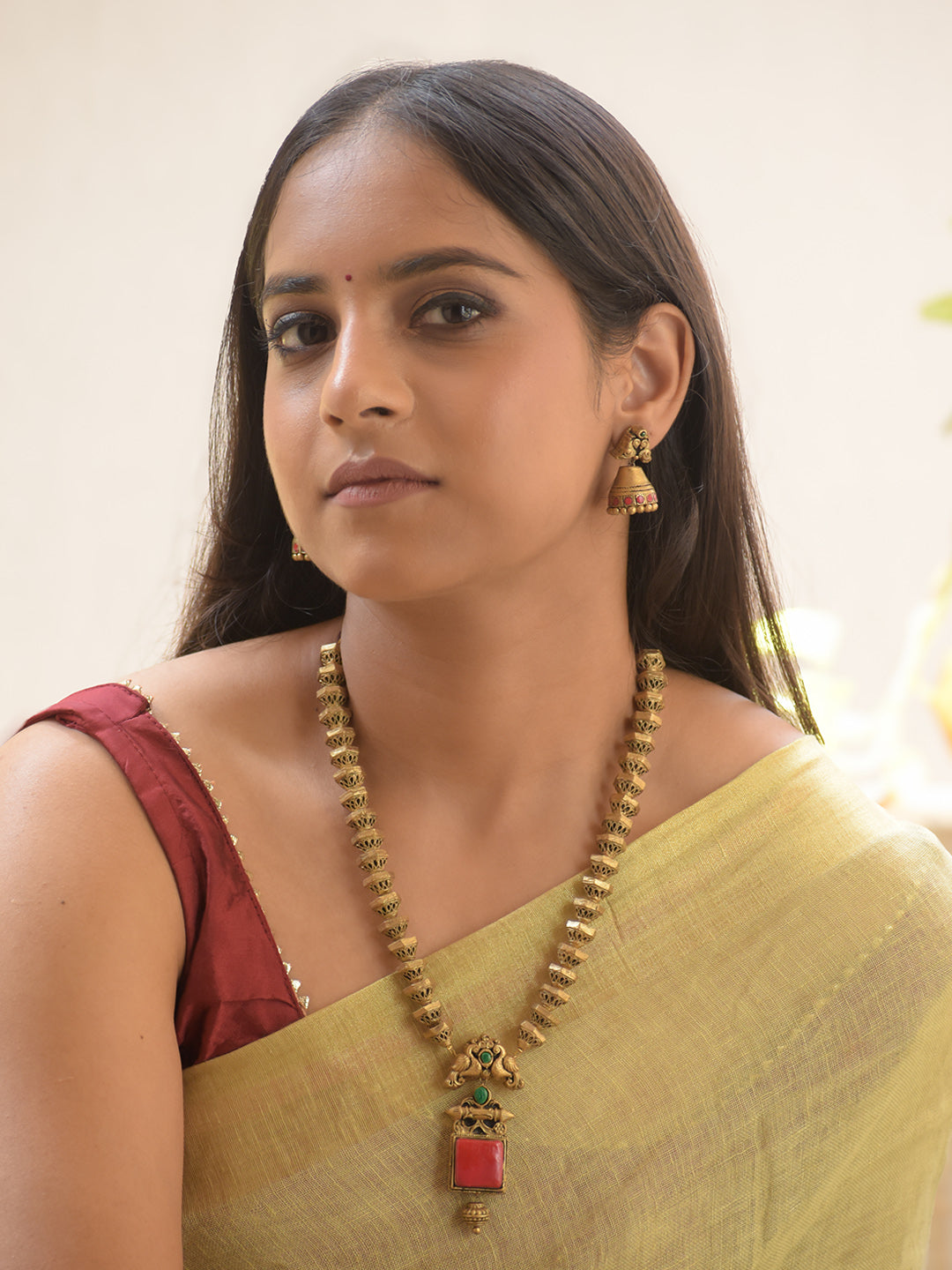 Peacoria - Handcrafted Antique Geometric Bead Terracotta Necklace Set with Red-Green Stone Pendant and Peacock Motif Earrings