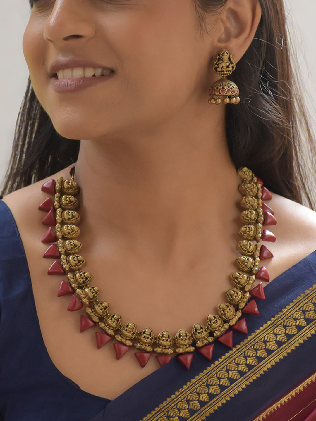 Lalita - Handcrafted Terracotta Lakshmi Motif Necklace Set with Red Cone Beads and Antique Gold Finish Earrings
