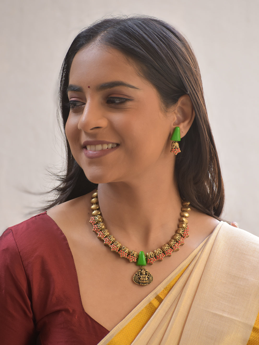 Harini – Terracotta Antique Gold Elephant Motif Necklace with Green Cone Beads & Goddess Pendant