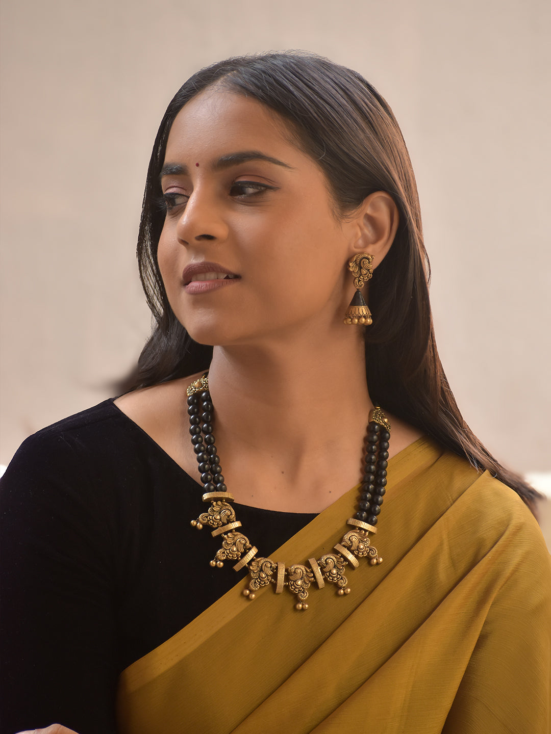 Garudini – Handmade Terracotta Black Bead Necklace Set with Antique Gold Temple Motifs and Matching Jhumkas