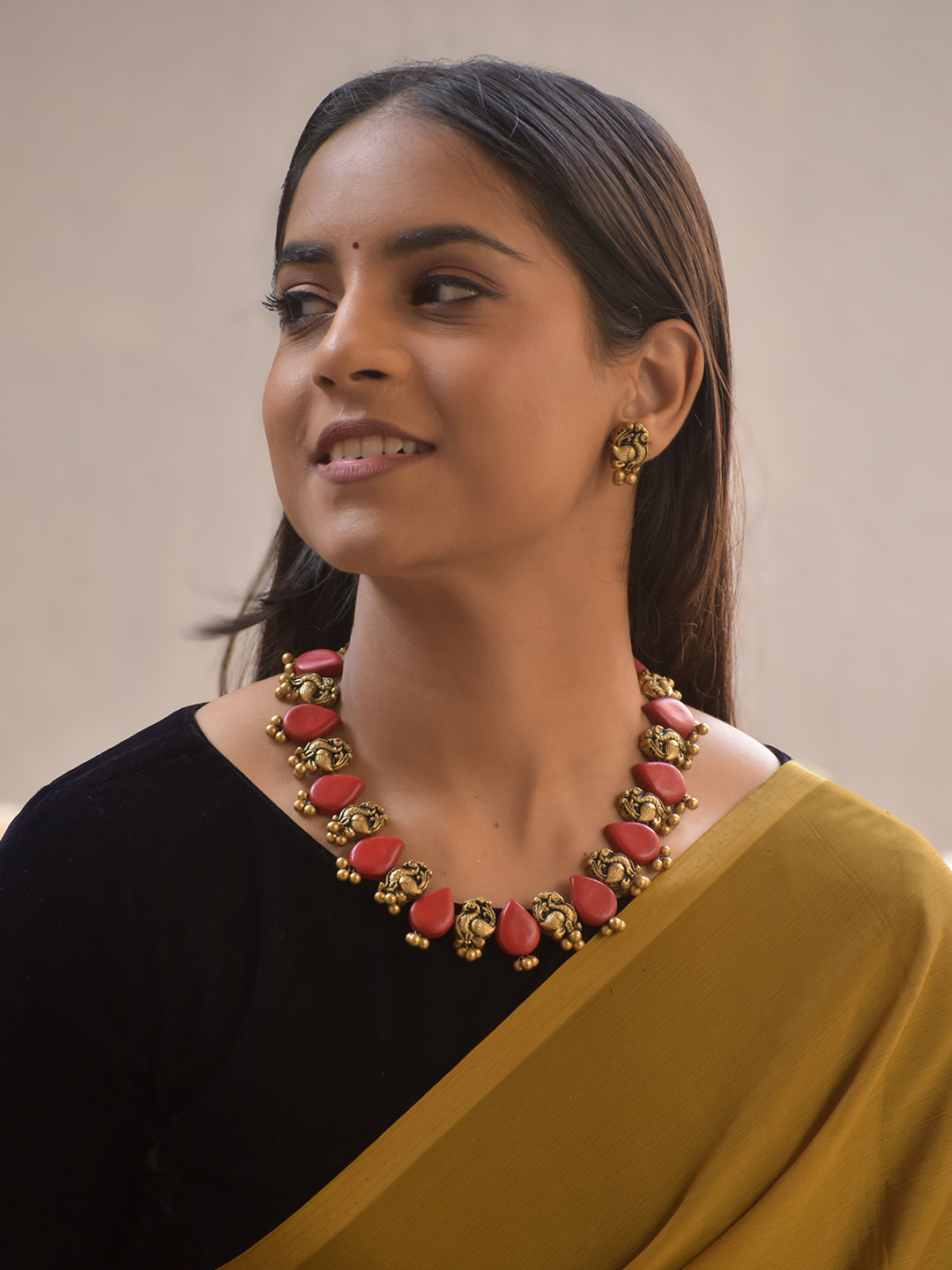 Raktamukhi – Handmade Terracotta Necklace Set with Red Teardrop Beads and Antique Gold Peacock Motifs