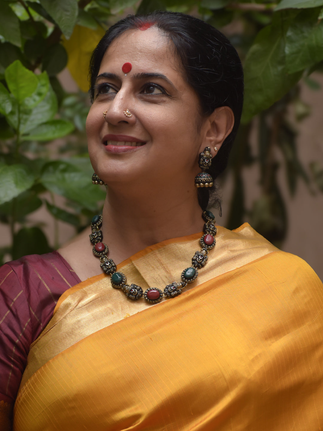 Handcrafted Terracotta Necklace Set with Red-Green Stones & Lord Venkateshwara Face Motifs