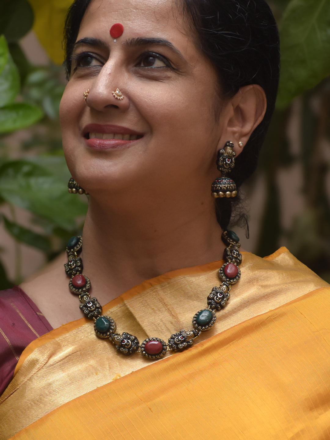 Handcrafted Terracotta Necklace Set with Red-Green Stones & Lord Venkateshwara Face Motifs