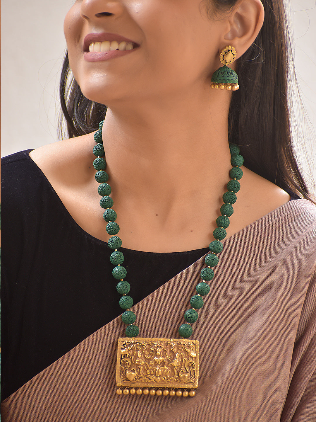 Divyakriti – Handmade Terracotta Temple Pendant Necklace Set with Green Textured Beads and Antique Engraved Jhumka Earrings