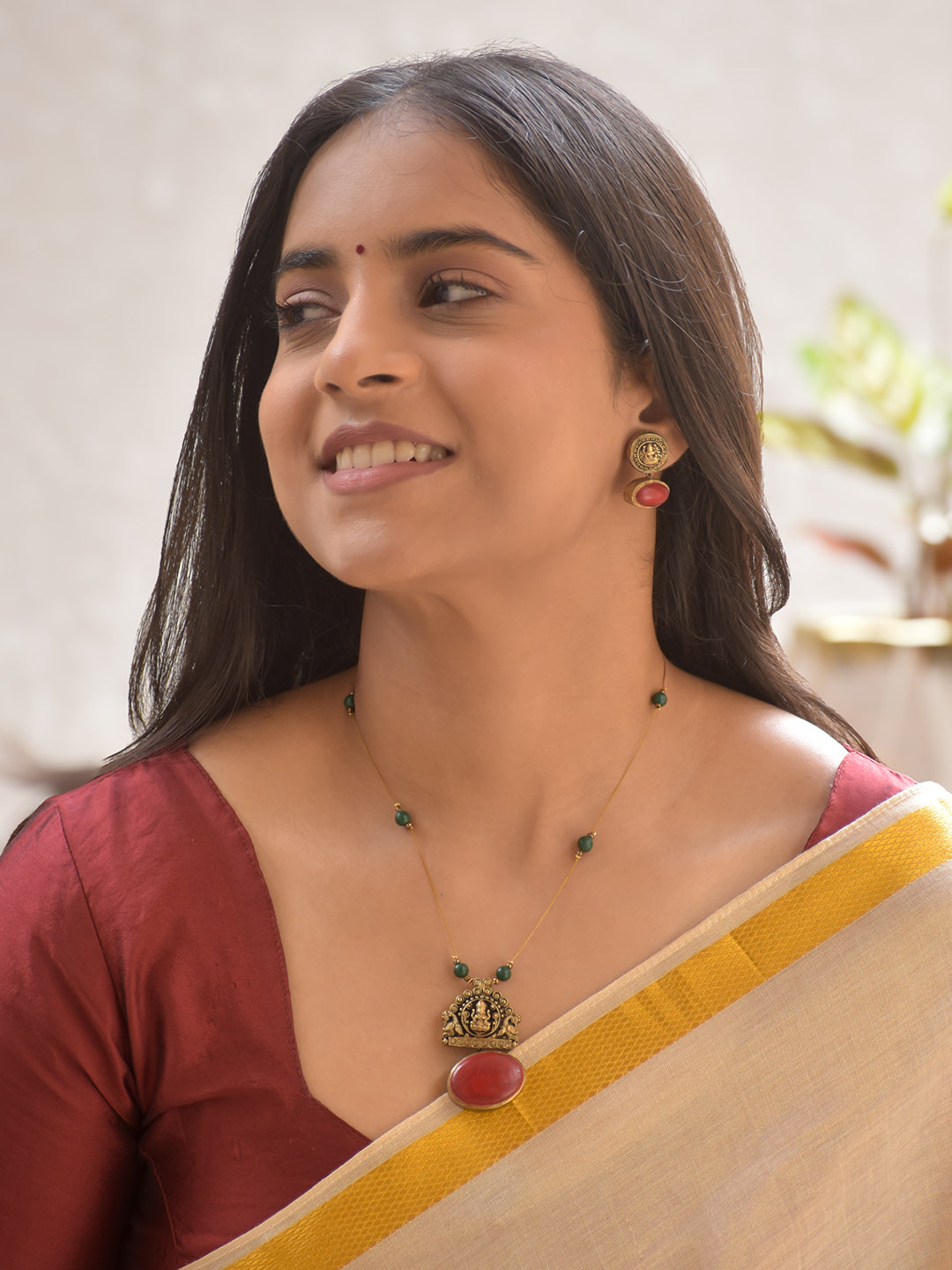 Terracotta Lakshmi Temple Pendant Necklace Set with Green Beads and Ruby Stone Accents