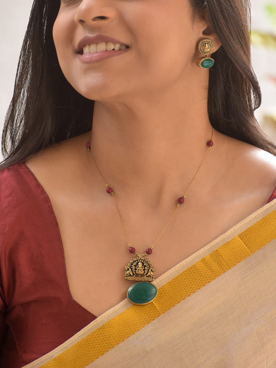 Terracotta Lakshmi Temple Pendant Necklace Set with Red Beads and Green Stone Highlights