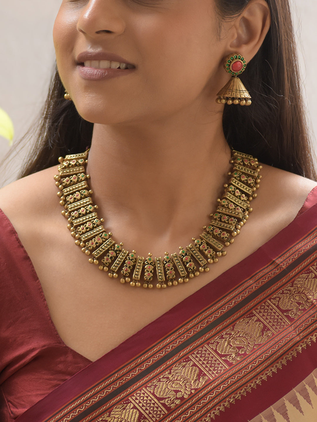 Chakrika - Handcrafted Antique Gold Step-Panel Terracotta Necklace Set with Red-Green Stone Detailing and Bold Earrings