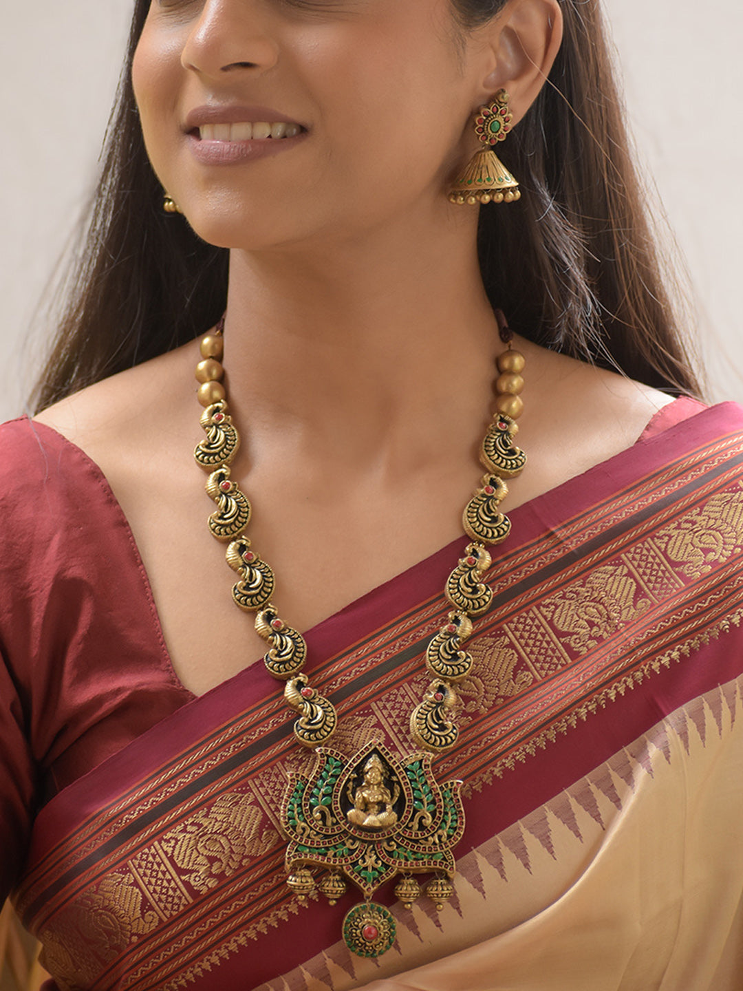 Mayurapriya - Handcrafted Terracotta Lakshmi Pendant Necklace Set with Peacock Links and Red-Green Stone Work and Matching Earrings