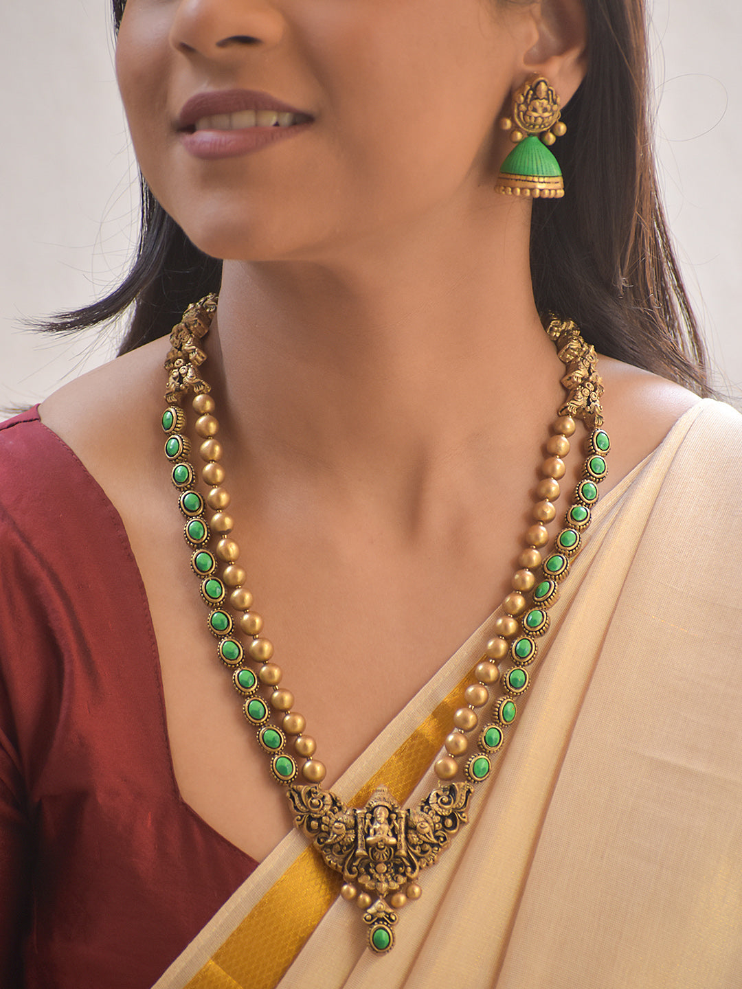 Harini – Terracotta Lakshmi Pendant Long Necklace Set with Green Stone Accents