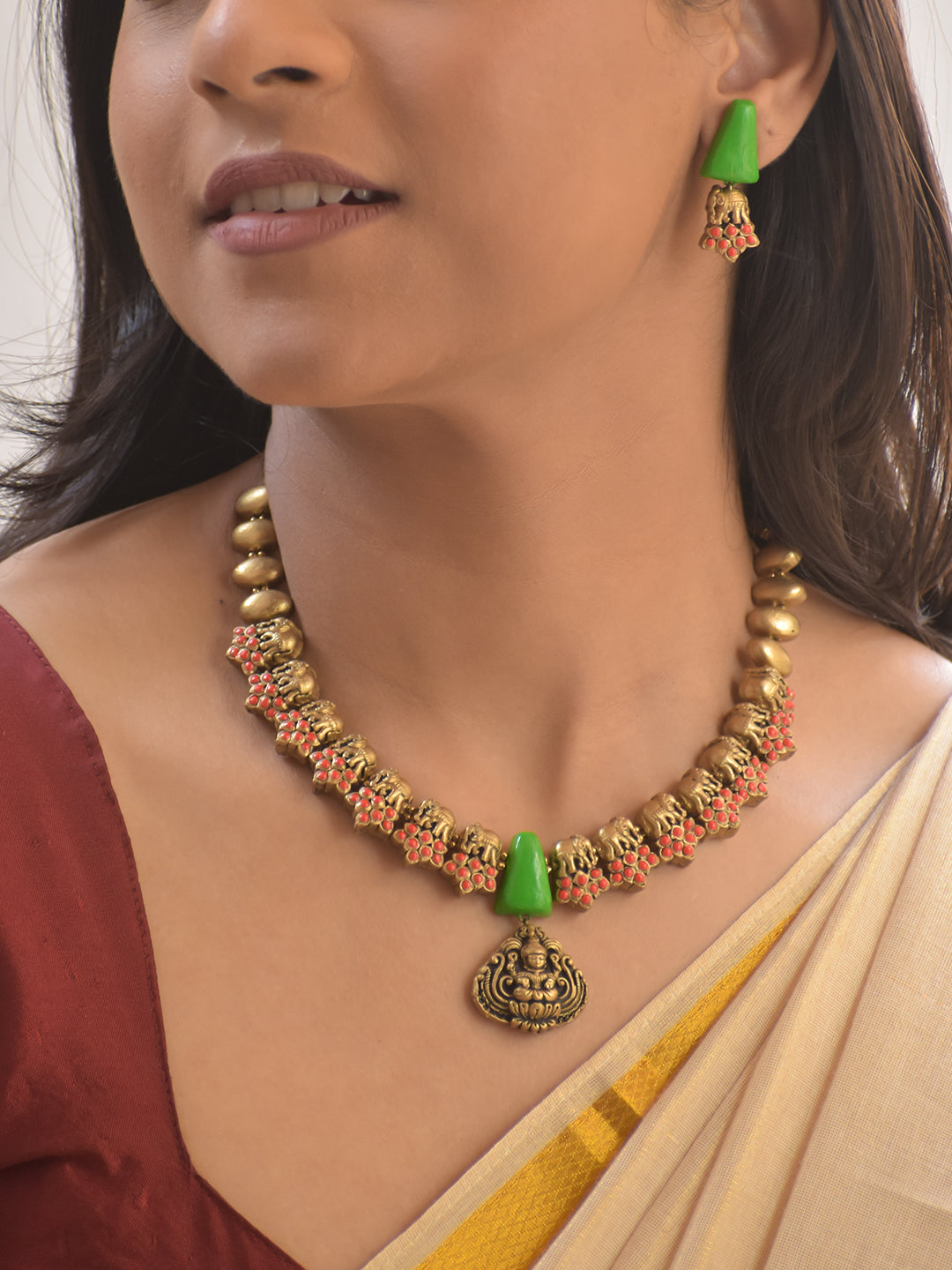 Harini – Terracotta Antique Gold Elephant Motif Necklace with Green Cone Beads & Goddess Pendant