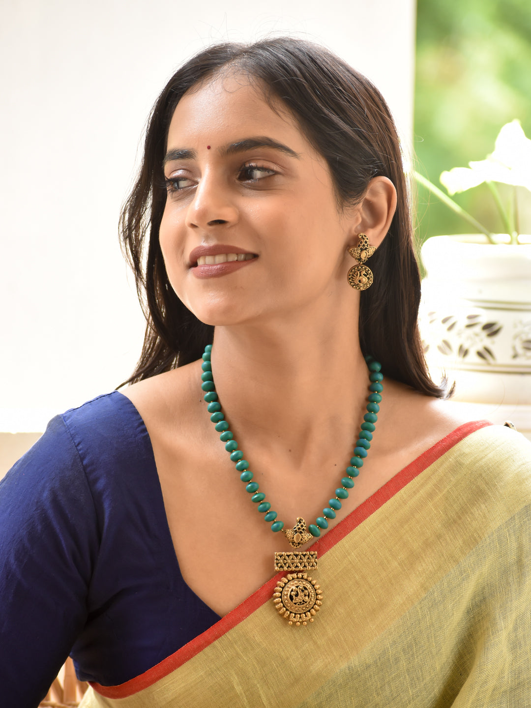 Aakriti - form, design Peacock Pendant Turquoise Beaded Necklace Set