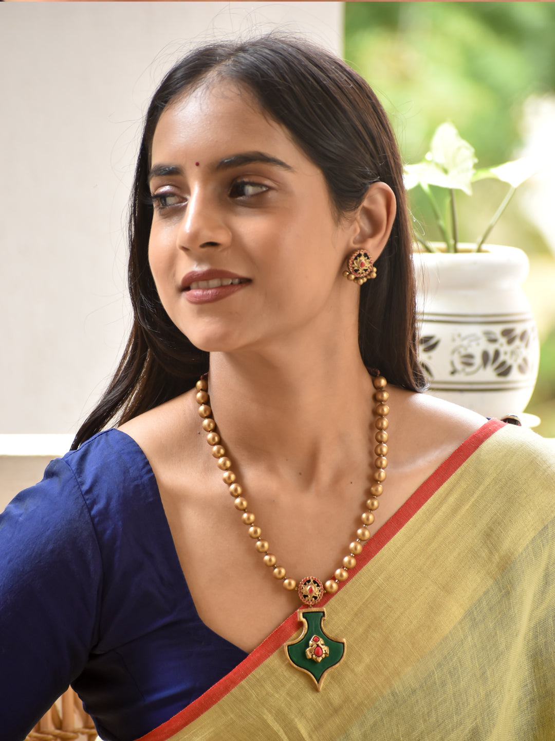 Aaditri - goddess Lakshmi Emerald Lotus Pendant Antique Gold Handmade Terracotta Necklace Set