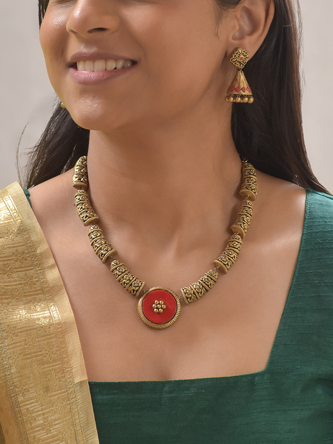 Rajalata - Handcrafted Antique Gold Terracotta Necklace Set with Red Floral Centerpiece and Matching Earrings