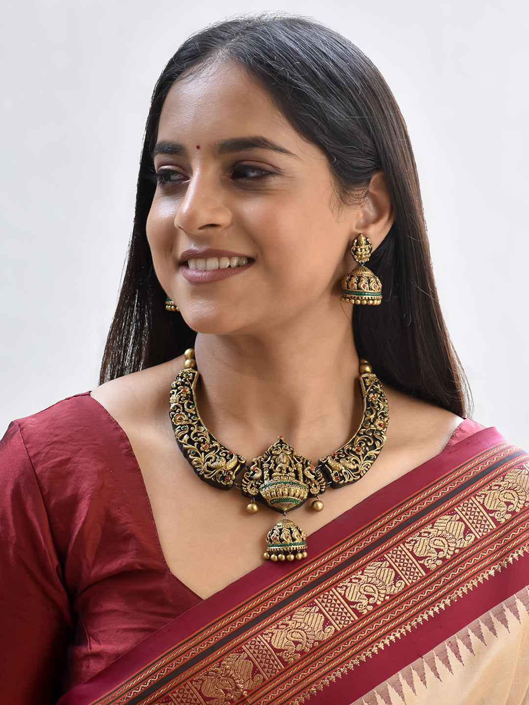 Handcrafted Lakshmi Pendant Temple Jewellery Set in Antique Gold with Red & Green Accents