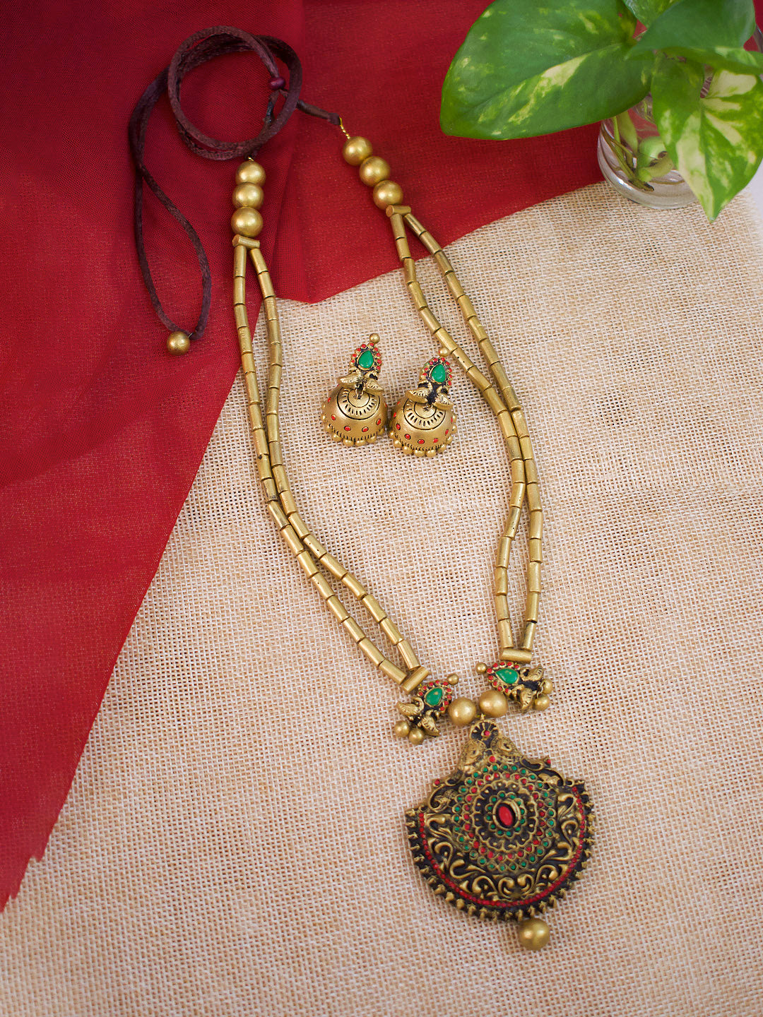 Dvimayura — Antique Gold Toned Peacock Design Pendant Two Layered Cylindrical Shape Beads Terracotta Necklace Set