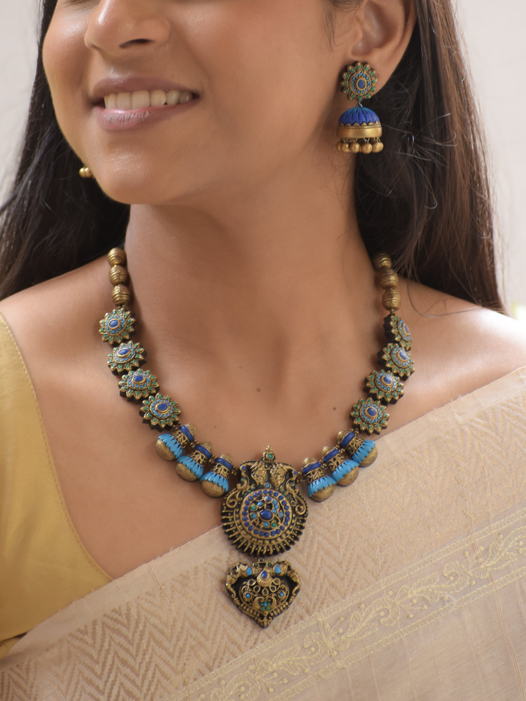 Neelambari - Handmade Terracotta Blue Statement Necklace Set with Floral Motifs and Antique Finish Earrings