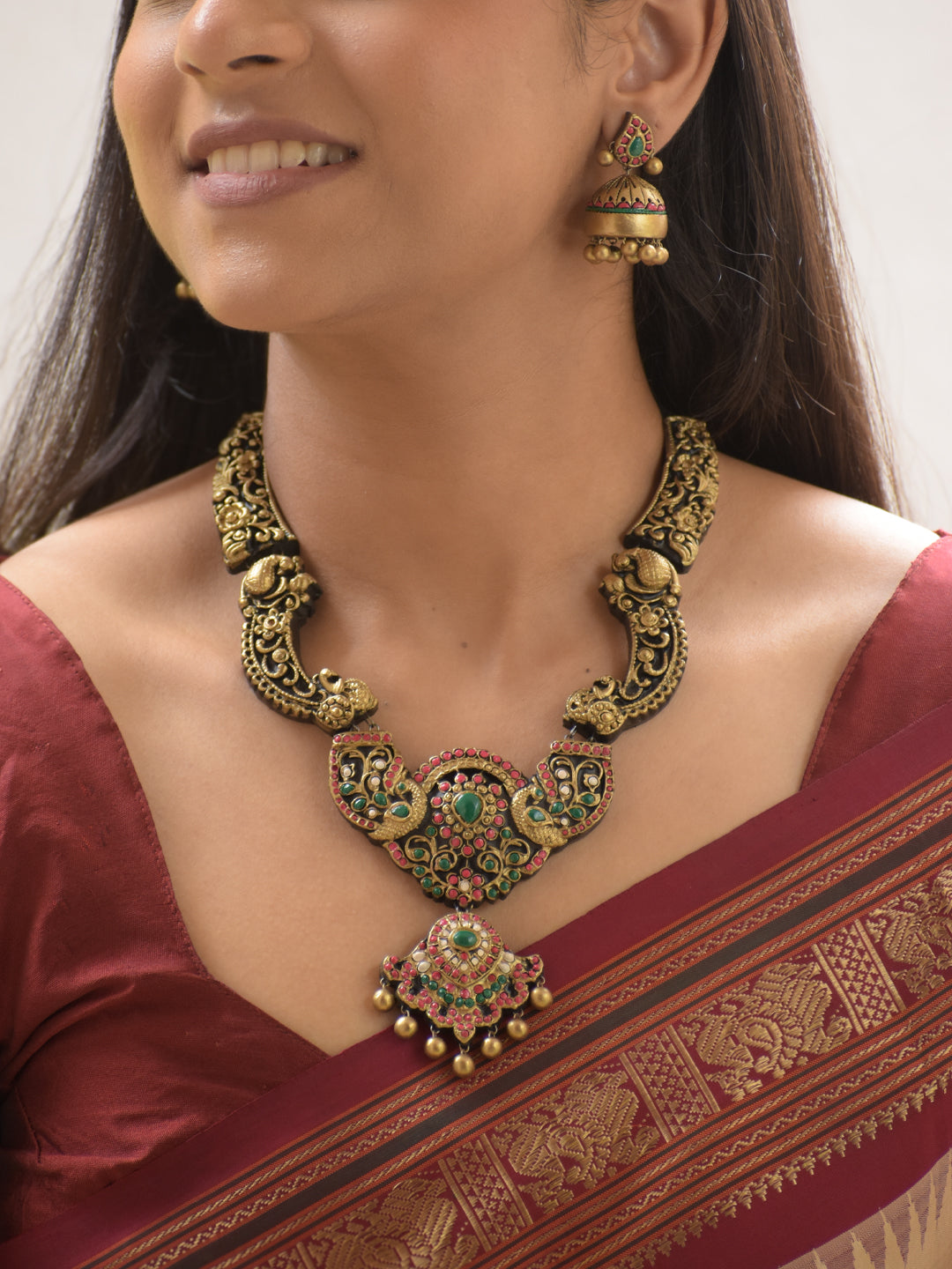 Mayurangana - Handmade Terracotta Peacock Necklace Set with Red-Green Stones and Antique Floral Engraving Earrings