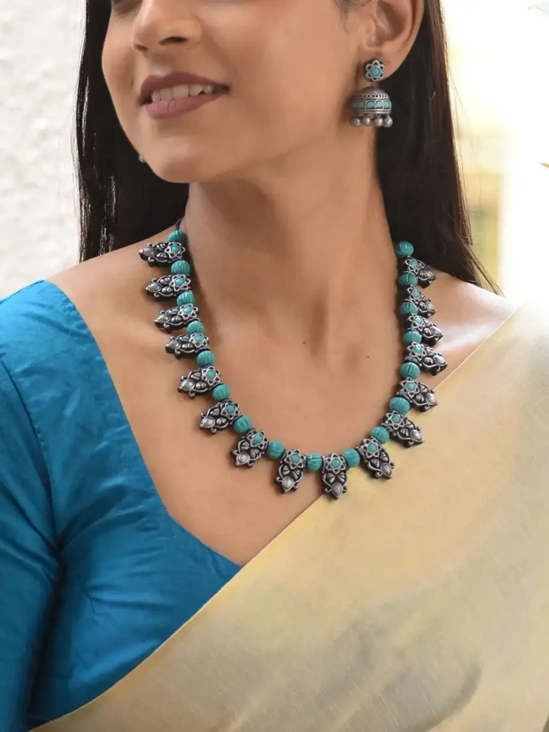 Shivaranjani - Handmade Terracotta Oxidized Silver Peacock Necklace Set with Blue Accents and Matching Earrings