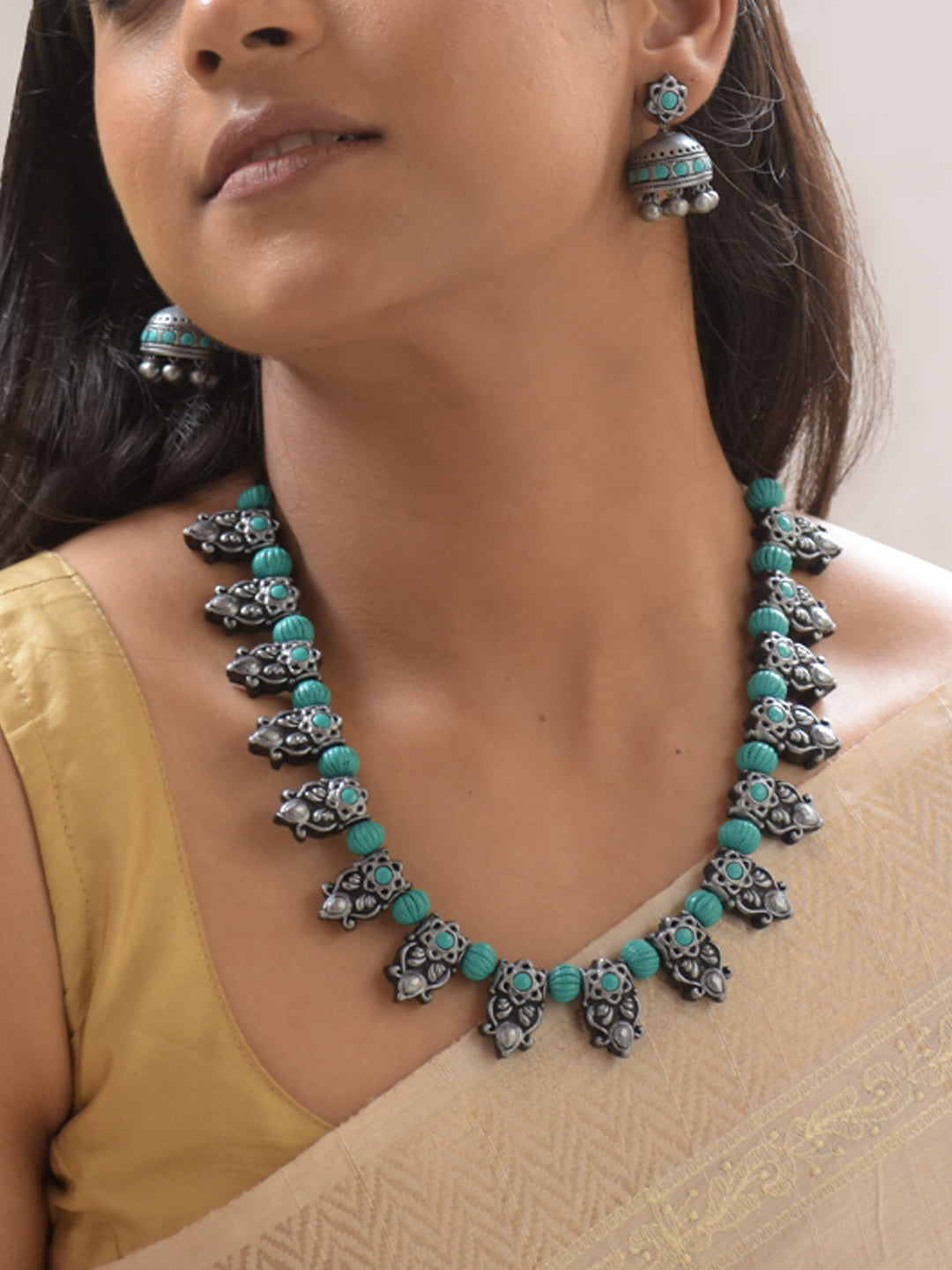 Shivaranjani - Handmade Terracotta Oxidized Silver Peacock Necklace Set with Blue Accents and Matching Earrings
