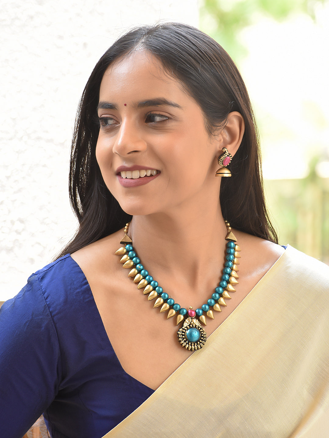 Terracotta Beaded Necklace with Spike Detailing and Statement Pendant
