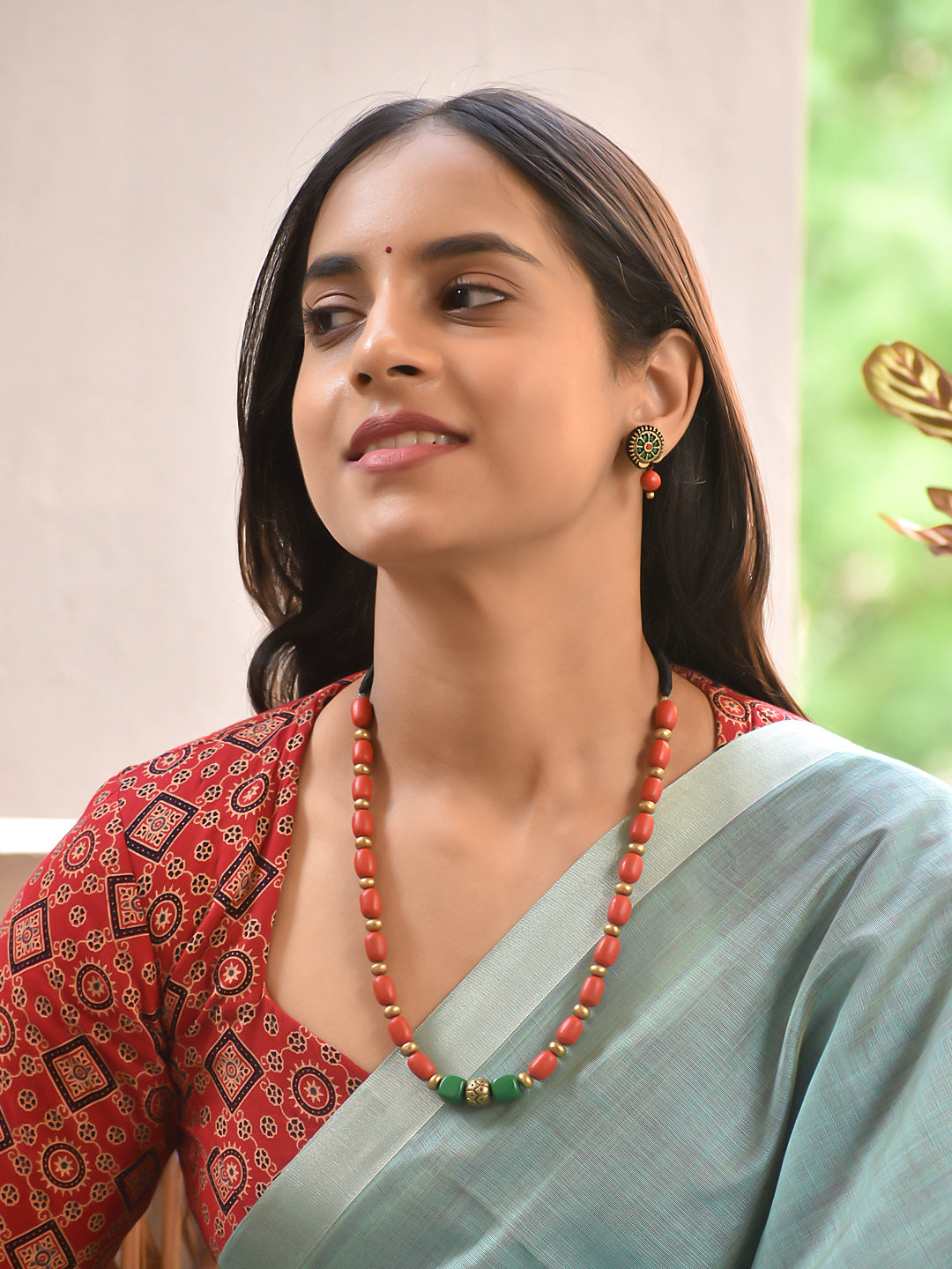 Terracotta Coral Bead Necklace with Green Accent Center